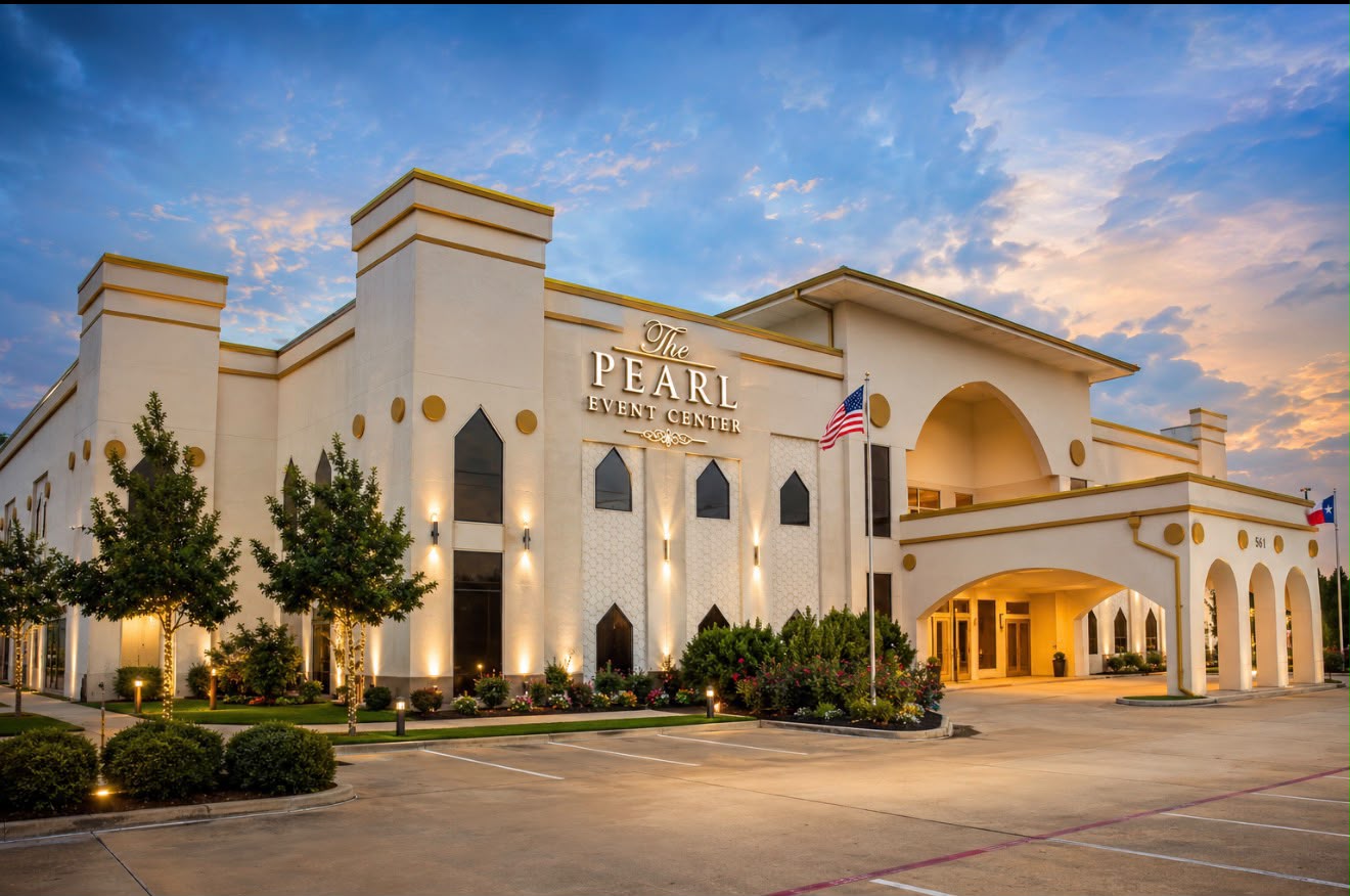 The Pearl Event Center building illuminated at dusk